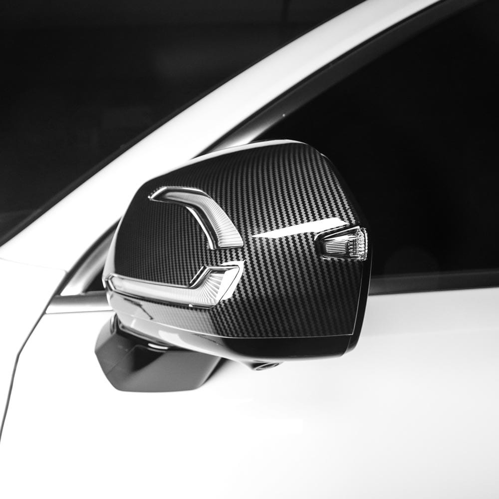 Black carbon fiber textured Hyundai Palisade led mirror cover with sleek silver accent trim for 2020-2025 models.