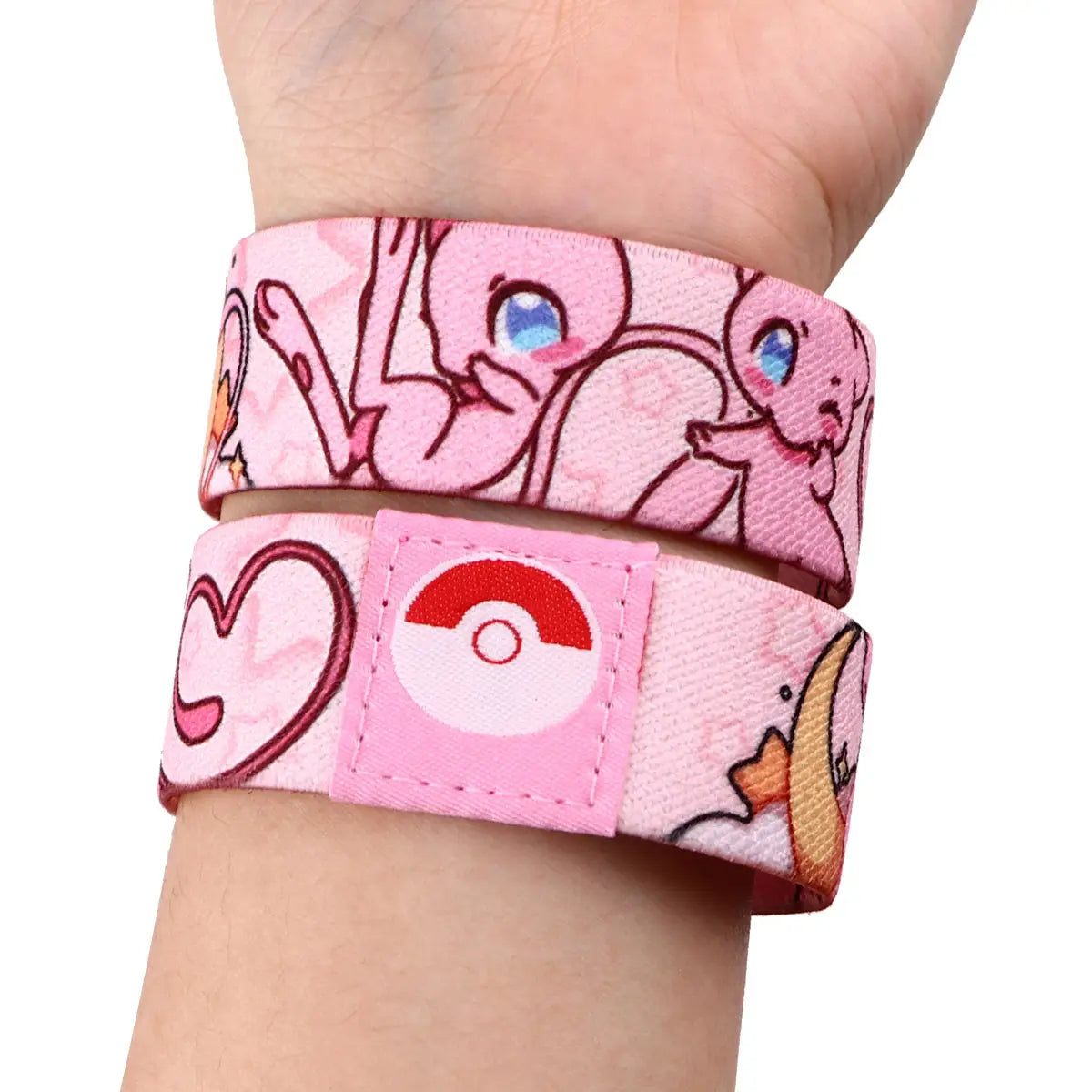 pink stretch wristband bracelet featuring cartoon Pokémon characters and a fabric red and white poké ball patch