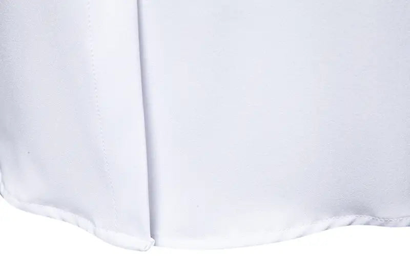 White pleated skirt with smooth crisp fabric finish paired with men asymmetrical slant collar long sleeve casual shirt.