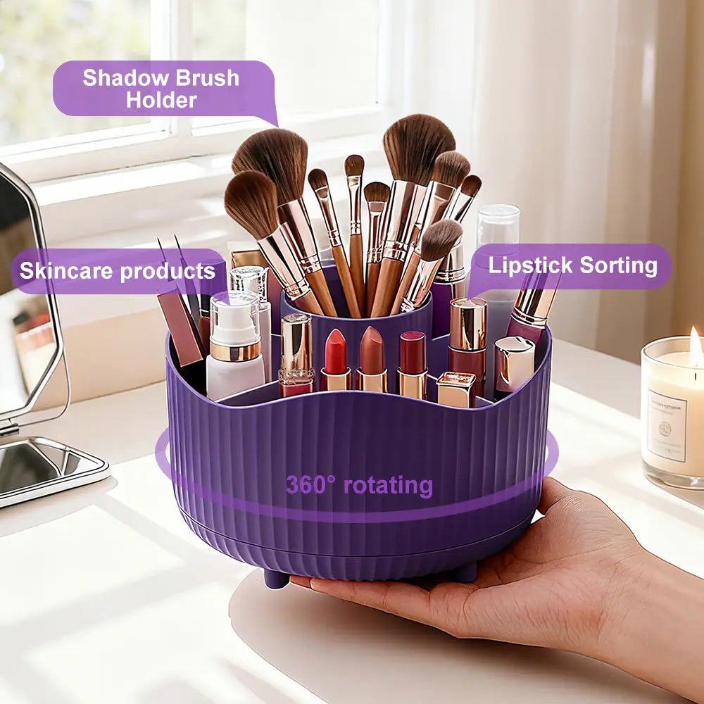 Purple rotating makeup organizer with 360-degree rotation and segmented compartments for brushes lipsticks and skincare products.
