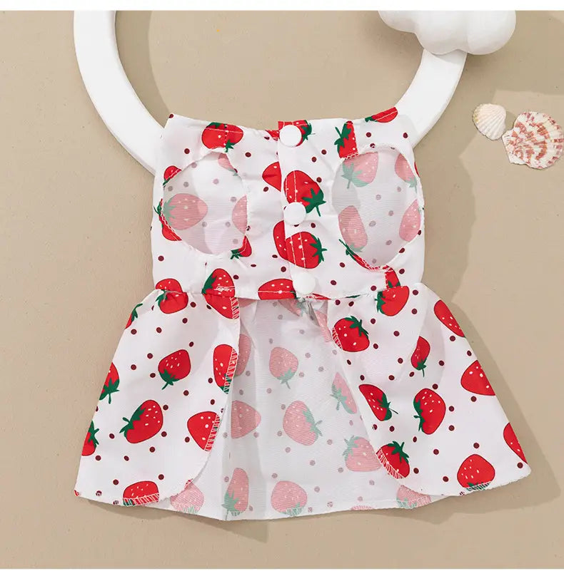 white strawberry-patterned pet dress with red and pink strawberries and frilled hem for floral dog princess dress with bow