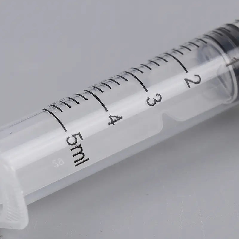clear plastic 5ml pet oral syringe with black measurement markings and silicone nipple for feeding pets