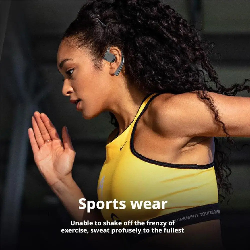 A gray Bluetooth 5.4 wireless gaming sports earbud with a sleek ergonomic design worn in the woman’s right ear.