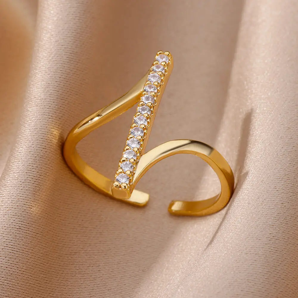 Gold-toned open stainless steel ring for women featuring a central bar with clear sparkling zircon geometric crystals.