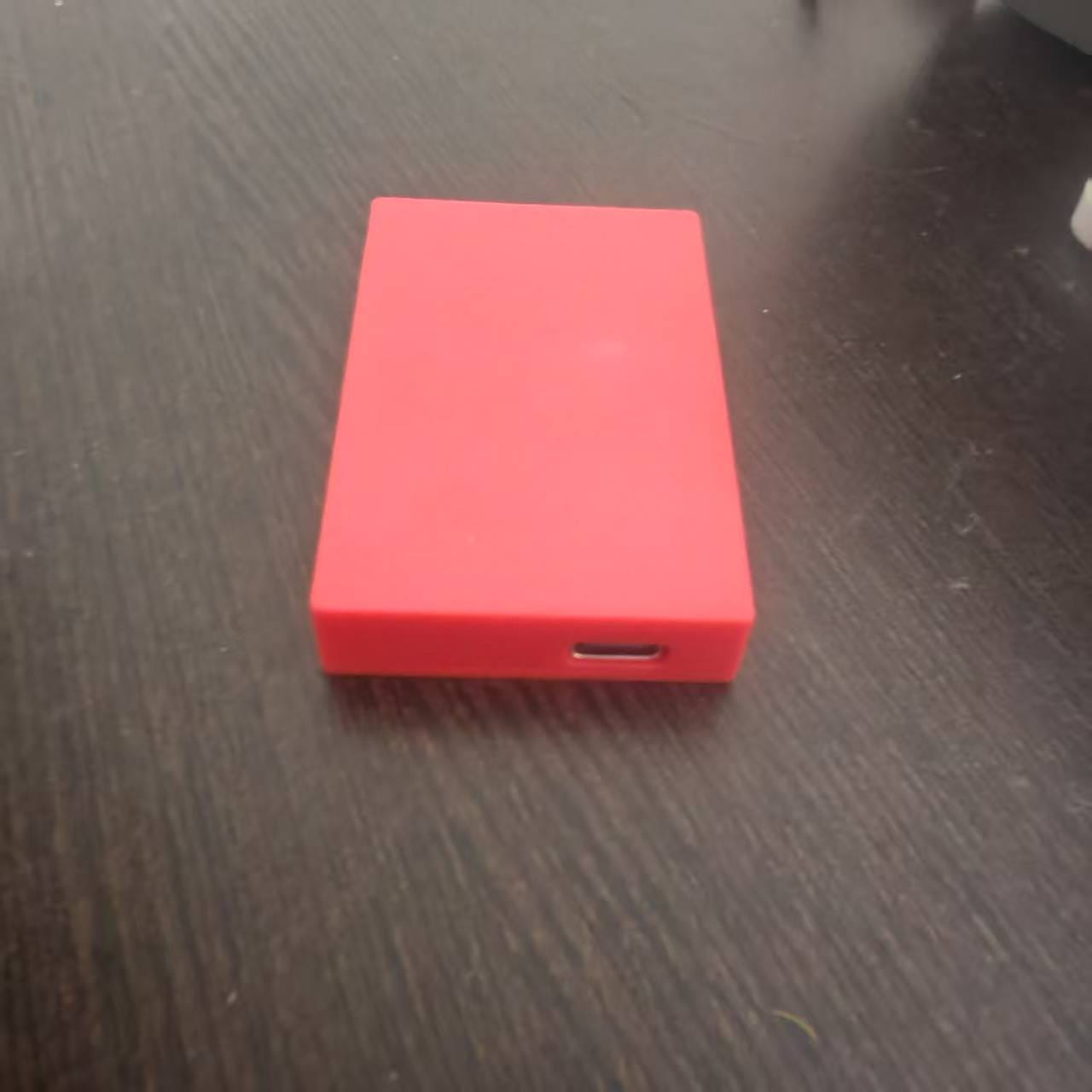 Red rectangular game card storage box v2 with a usb-c port on the side designed as a pink external accessory case.