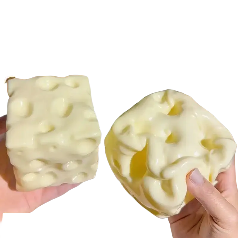 Creamy oversized cheese shaped slow rising squishy toy with glossy finish and realistic holes front view