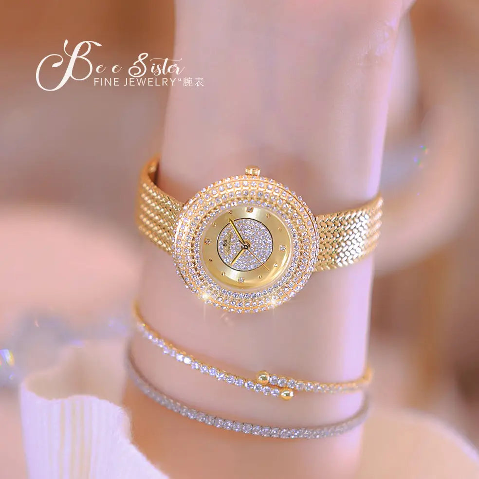 Gold-toned diamond-encrusted mesh women watch with a sparkling glittering face luxury waterproof design.