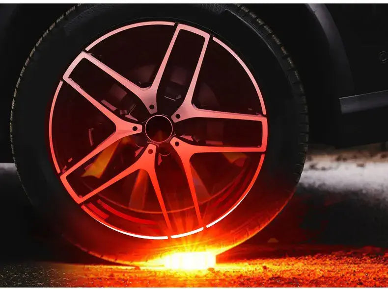 red illuminated alloy wheel with five-spoke design featured in a magnetic led roadside emergency strobe light product.
