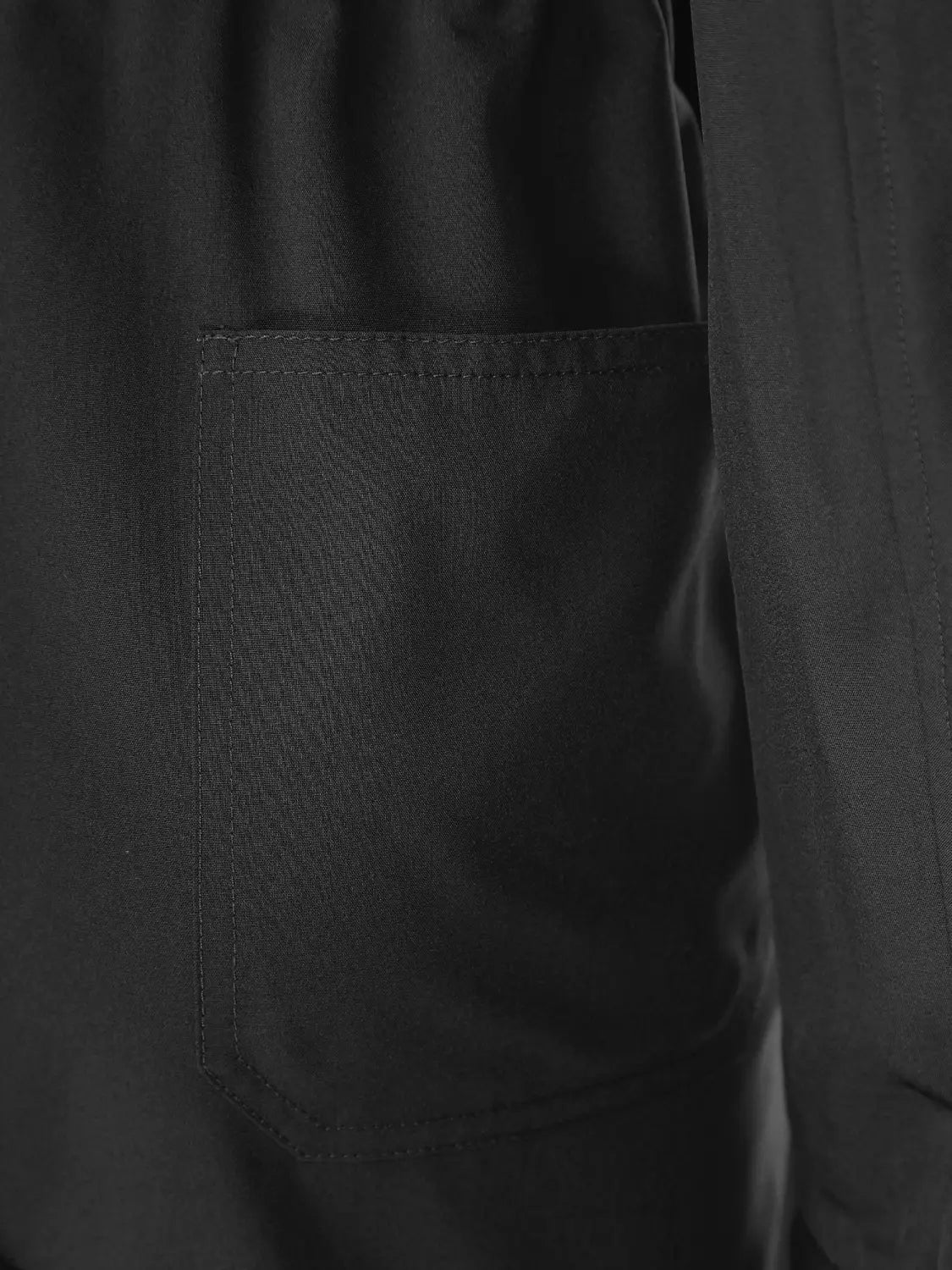 Royal blue long sleeve casual jumpsuit featuring a black leather patch pocket with visible stitching.