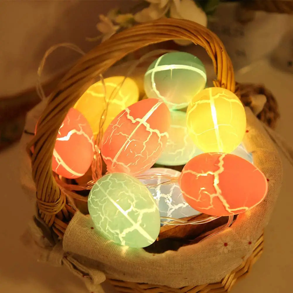 colorful crackled egg-shaped led string lights in warm orange yellow and green hues complement a 35cm straw easter rabbit figurines set.