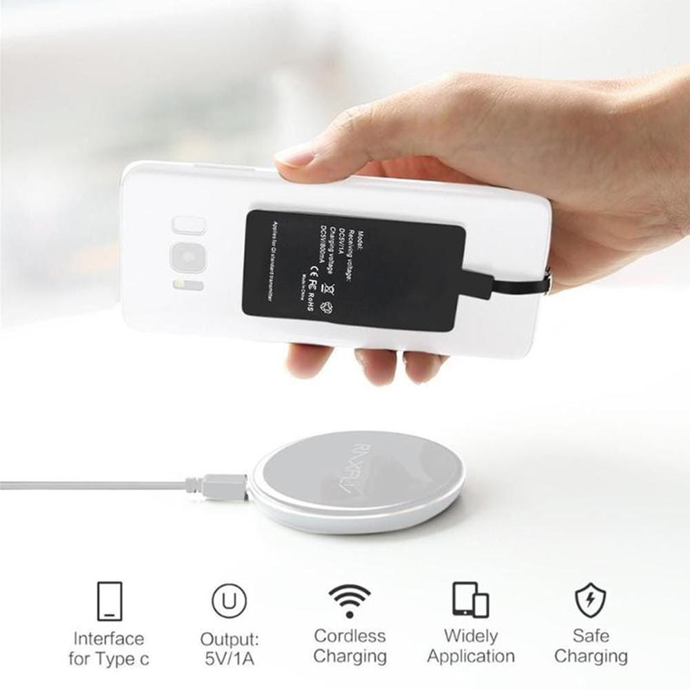 White circular wireless charging pad with minimalist design and subtle branding as a wireless charging receiver for type c android phones.