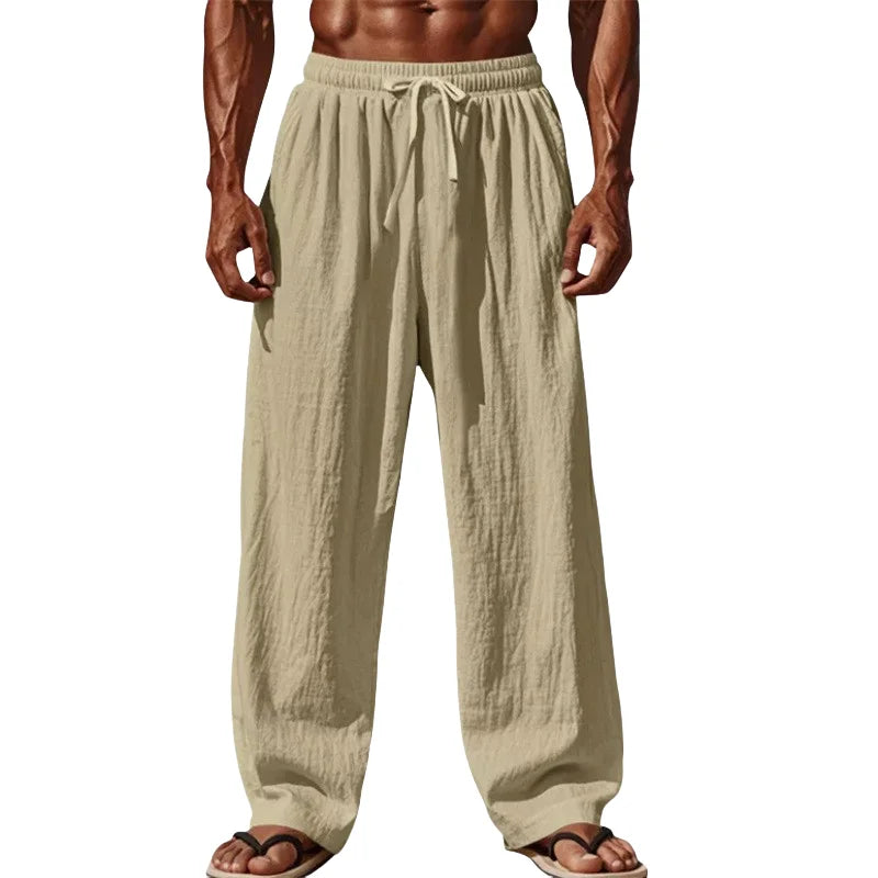 Beige cotton linen casual pants with a drawstring waist and loose straight leg fit for men.