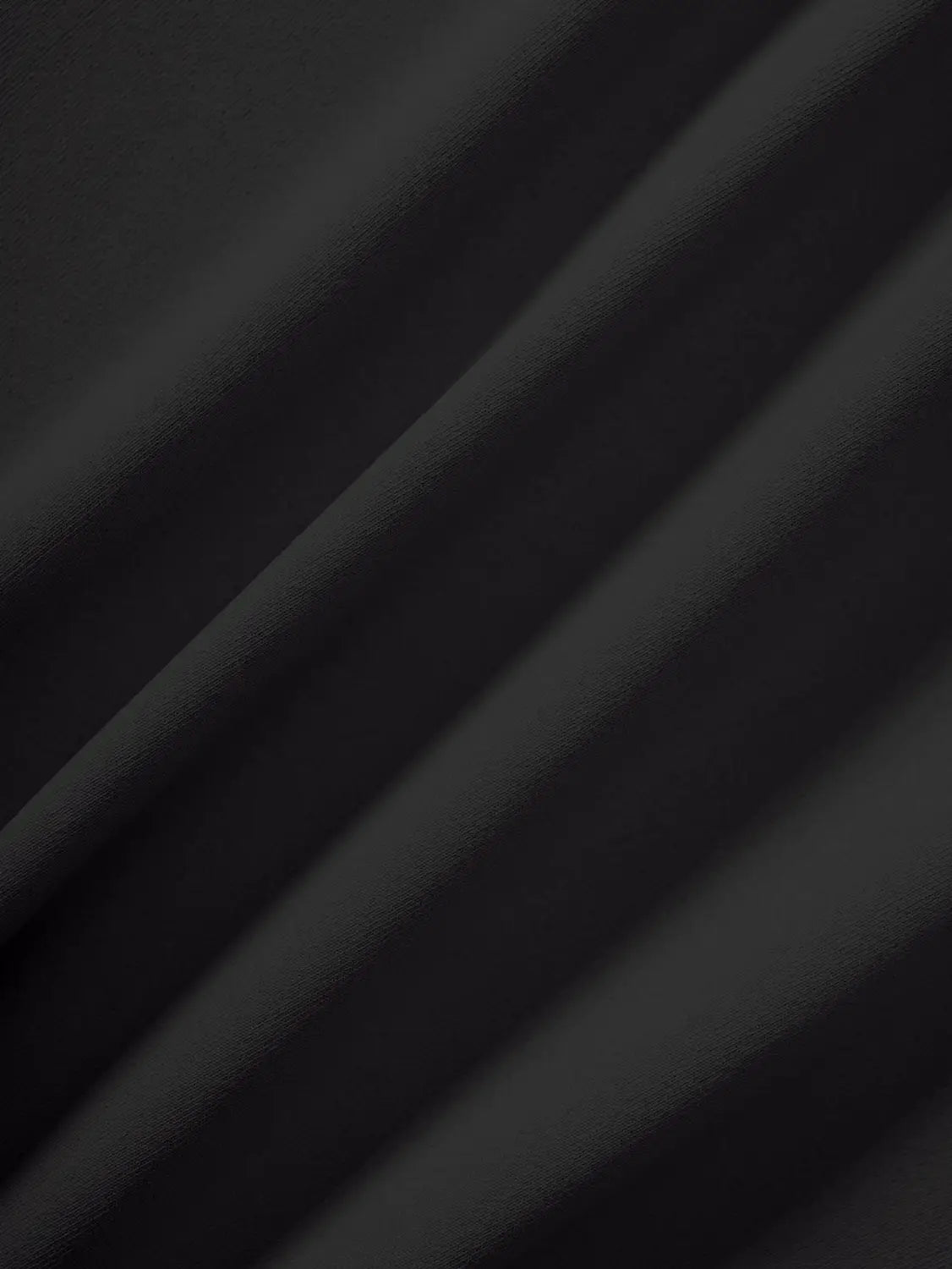 black high waist ruffle mini skirt made of black satin fabric with a smooth glossy texture and subtle diagonal folds.