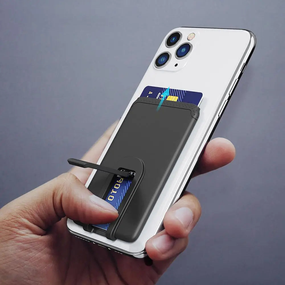 Black silicone phone card holder with a sleek minimalist design attached to the back of a white mobile phone for universal stick-on use.