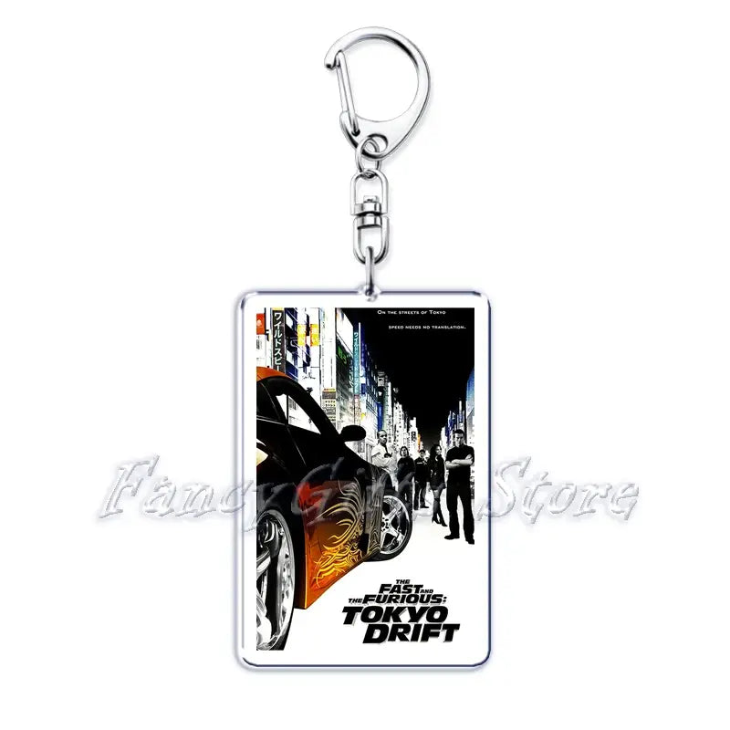 Rectangular acrylic keychain featuring a movie poster for the fast and the furious tokyo drift with black orange and white graphics from the movie poster acrylic keychain set.