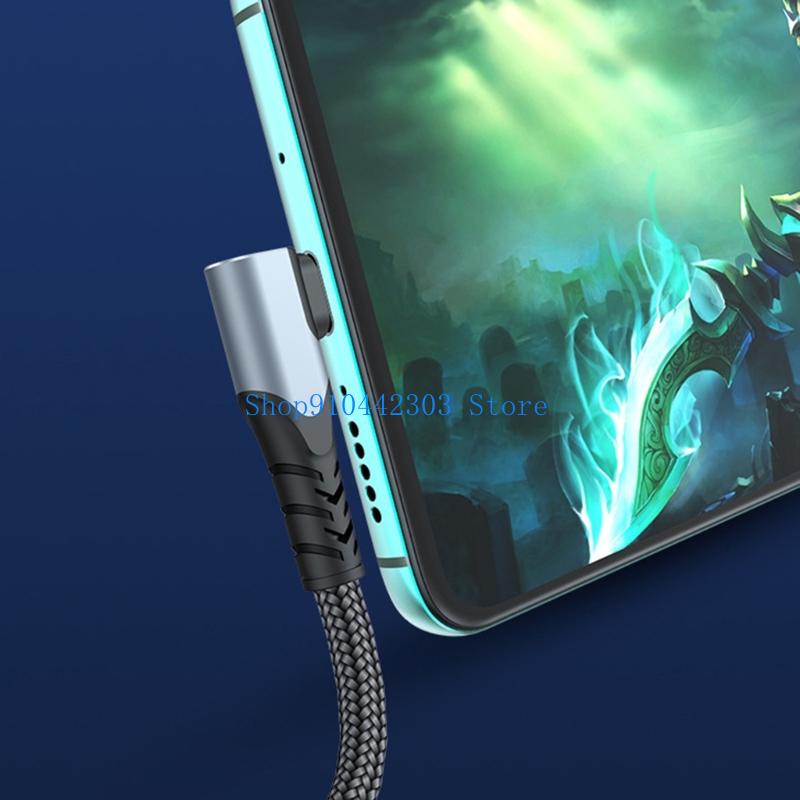 A sleek silver usb c cable with a black braided cord and textured grip featuring a straight head for 100w fast charging connected to the side of a smartphone.