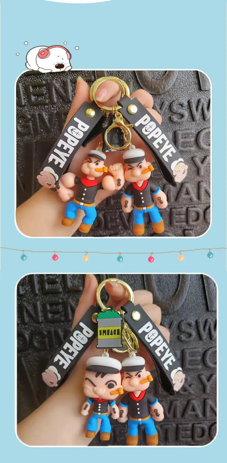 Popeye silicone keychain cartoon doll bag pendant featuring black straps and gold-colored metal rings.