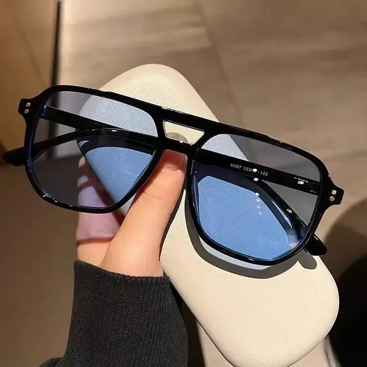 Vintage square sunglasses with a black frame, blue-tinted uv400 lenses, and rhinestone accents on the temples suitable for unisex use.