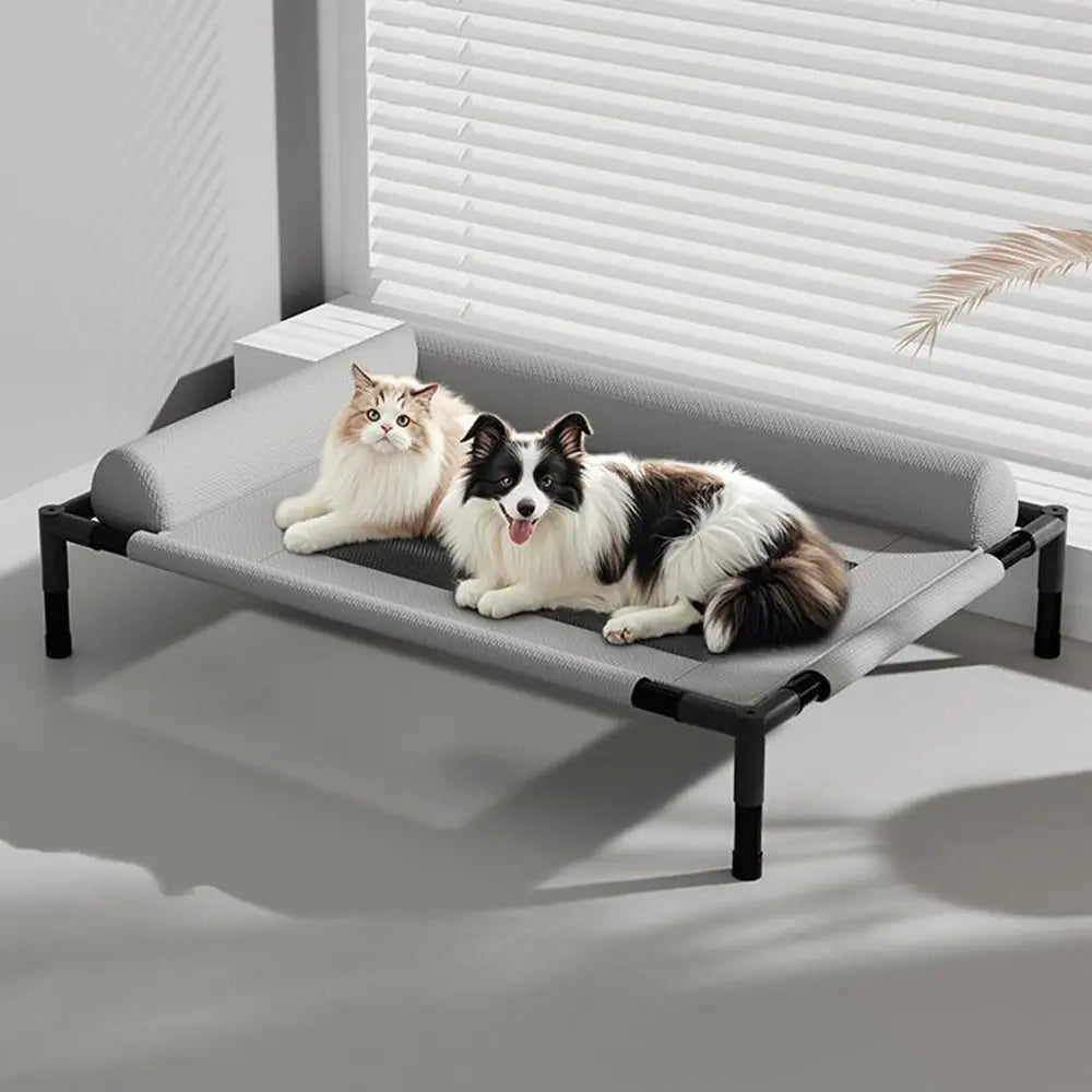 Gray mesh elevated dog bed with breathable fabric and black metal frame designed as a raised pet cot.