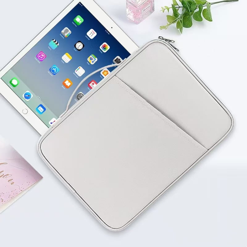 Light gray faux leather computer bag padded nylon tablet sleeve with zipper closure and internal pocket for ipad storage.