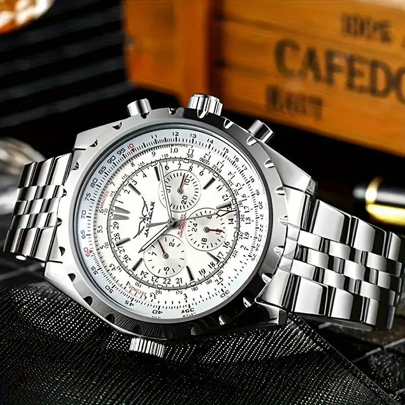 Mechanical stainless steel men’s chronograph watch with silver-toned case, white dial featuring black and red markings, three subdials, and stainless steel link bracelet.