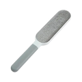 Gray and white double-sided manual hair remover lint brush with textured fuzzy surface for pet hair removal