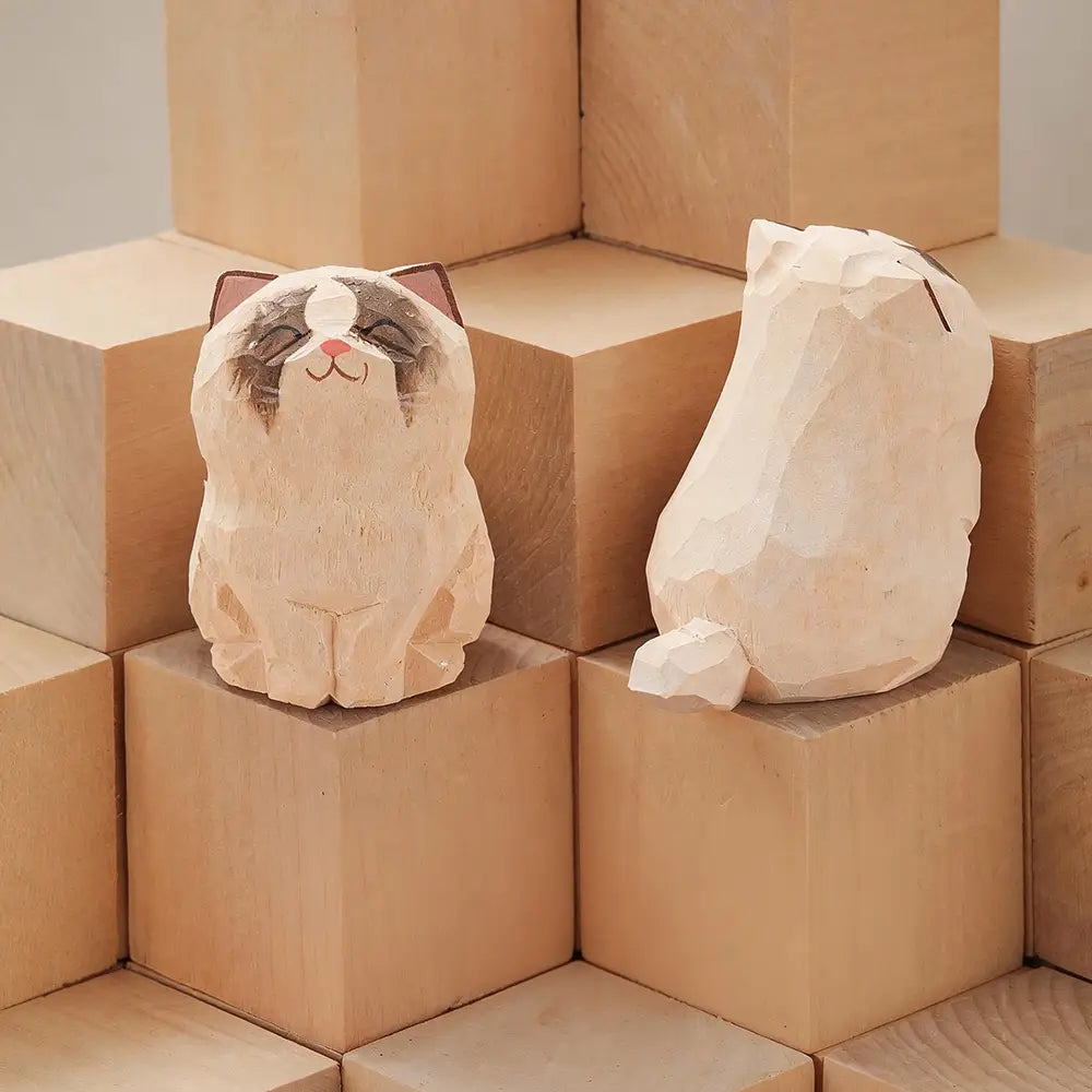 Handcrafted wooden cat figurine desk decor featuring cute hand-carved soft beige wood grain with painted facial features available as an actual product factory direct.
