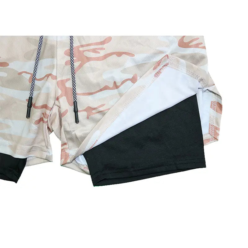 Men 2 in 1 gym shorts with beige and pink camouflage pattern and black quick dry inner lining for workout and activewear.