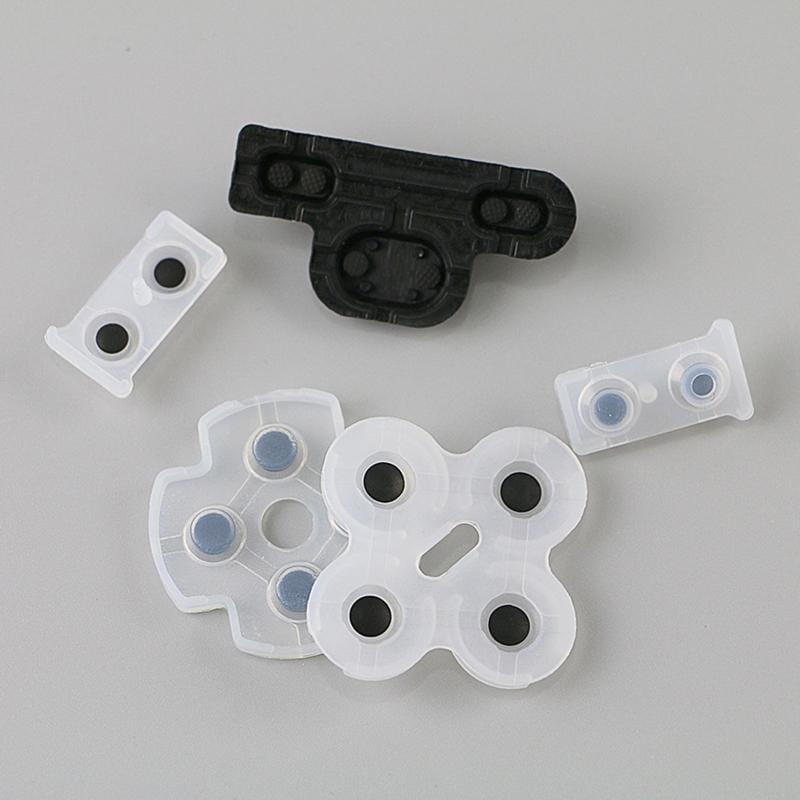 Weiße Kunststoff-Tastenabdeckungen für Spielcontroller mit schwarzen und blauen kreisförmigen leitfähigen Gummieinsätzen zur Ersetzung der leitfähigen Gummipolflächen im PlayStation-3-Controller