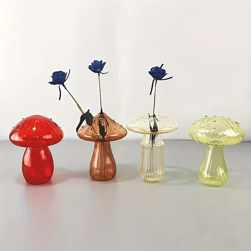 A set of four translucent glass mushroom bud vases in vibrant red copper clear with subtle texture and pale yellow designed as colorful Nordic plant holders.