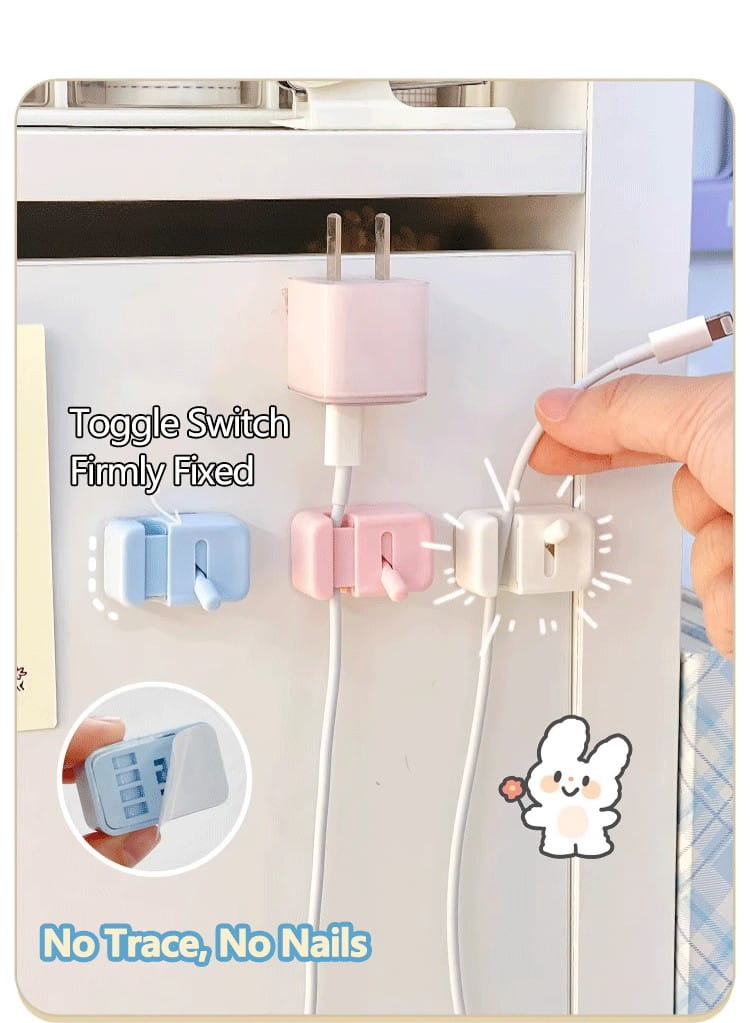 Support de prise magnétique aux couleurs pastel, avec un design à interrupteur à bascule, présenté pour un organisateur de cordon de pince de câble de bureau sans perçage.