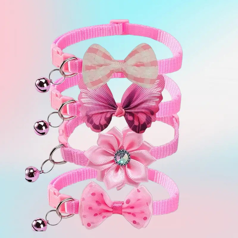adjustable pink bow cat collar with bell featuring decorative bows and dangling bells.