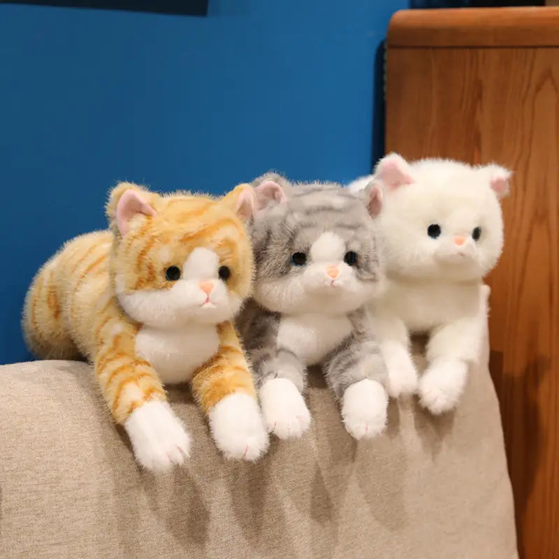three plush toys soft cute kitten stuffed animals pillow featuring a ginger tabby with white paws and chest a grey and white striped cat and a solid white cat made of soft fabric