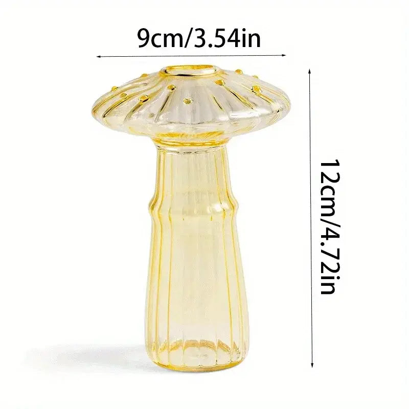 A translucent yellow glass mushroom bud vase with a fluted top and vertical ridges designed as a colorful Nordic plant holder.