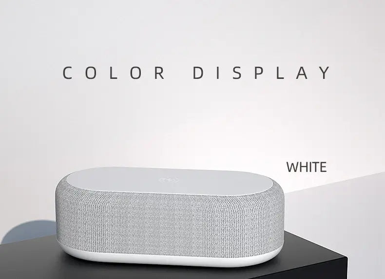 Haut-parleur Bluetooth rectangulaire blanc avec corps en tissu texturé gris et bords lisses en plastique blanc, doté d’une fonction de charge sans fil et d’un mode d’économie d’énergie