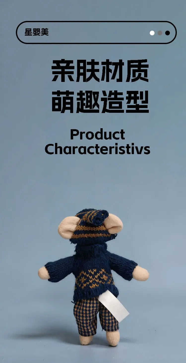 plush mouse doll stuffed animal toy knitted as a monkey wearing a navy blue sweater with geometric patterns plaid pants and a matching striped hat.