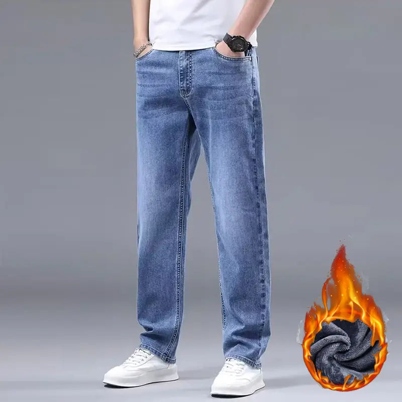 men fleece lined winter jeans in light-wash blue denim with a relaxed straight-leg cut and visible stitching details.