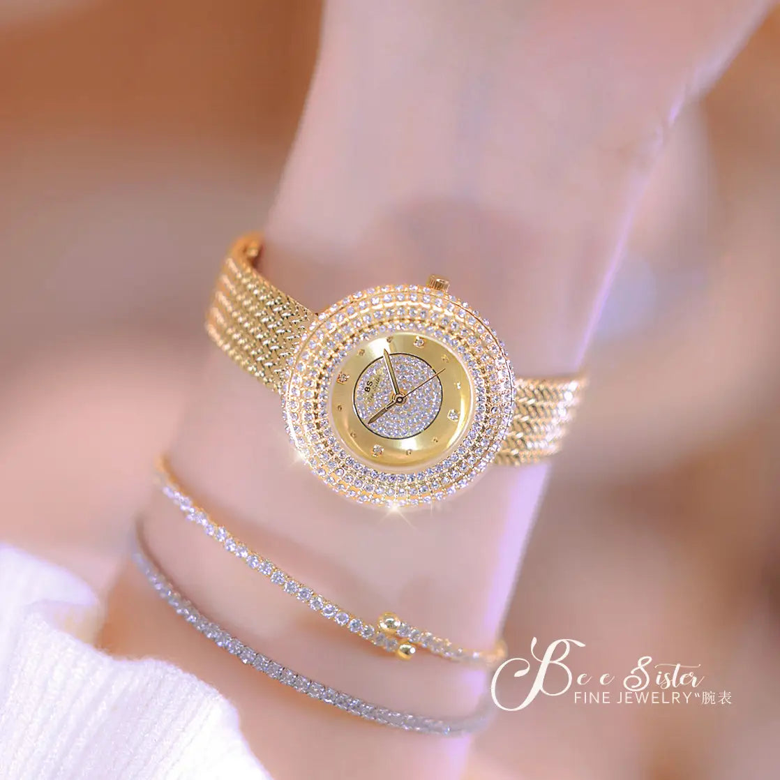 Gold-toned diamond-encrusted women watch with a mesh band and sparkling crystal dial in a luxury waterproof design.