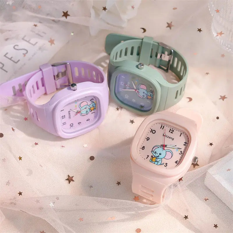 pastel-colored children’s luminous wristwatches featuring cute cartoon mouse faces on square-shaped dials with white silicone straps designed for kids.
