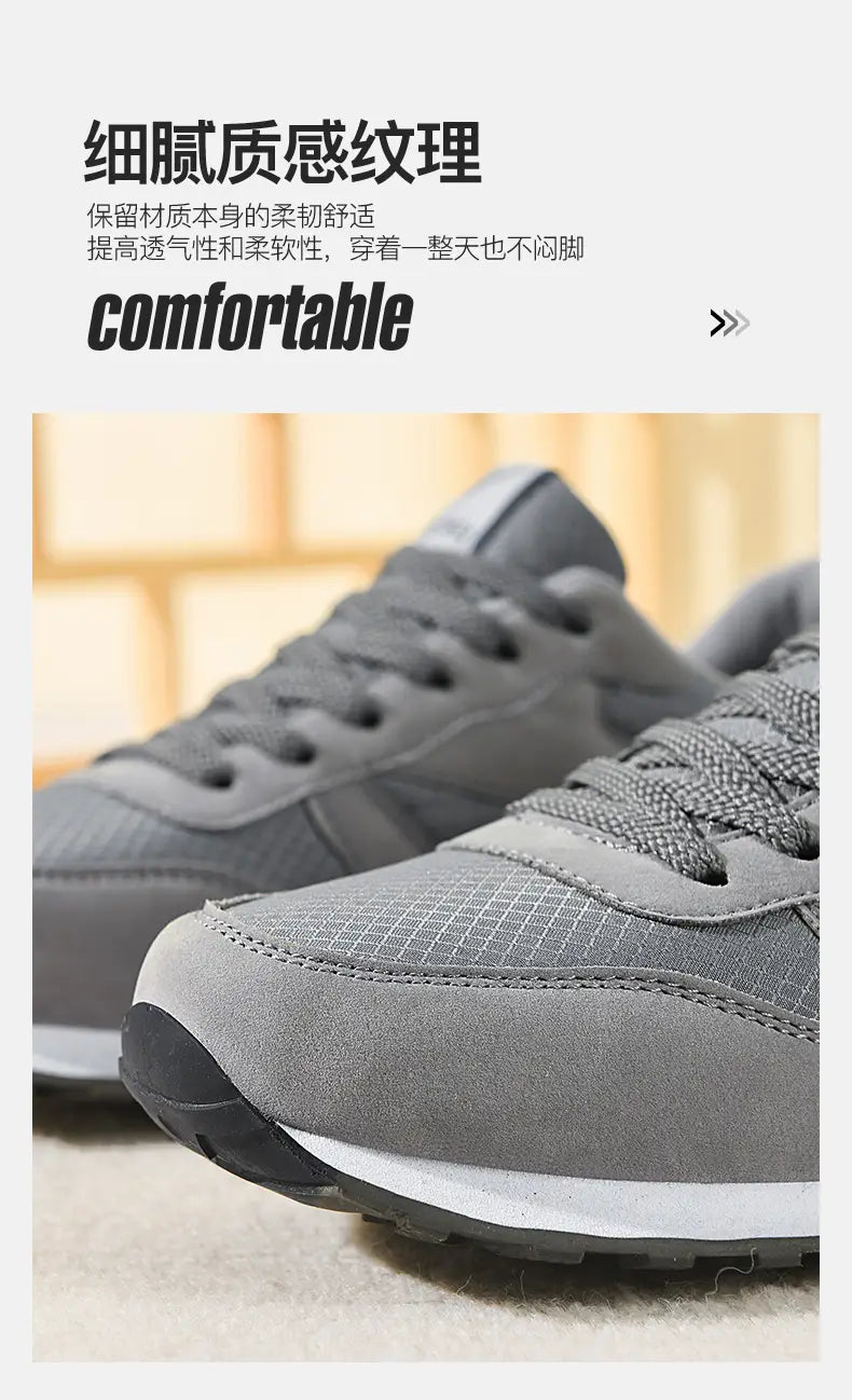 Herrenfreizeitsneaker in Grau und Weiß zum Gehen mit Obermaterial aus Mesh und Wildleder, mit weißer Zwischensohle und schwarzer Außensohle.