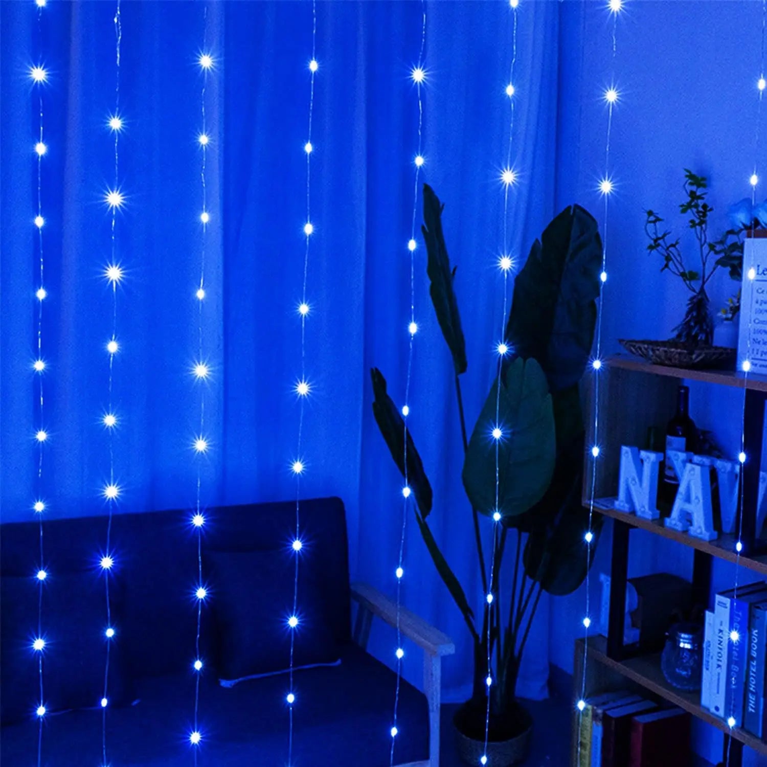 led curtain fairy lights usb remote bedroom decor featuring blue string lights with bright star-shaped bulbs hanging vertically to create a festive and cozy ambiance.