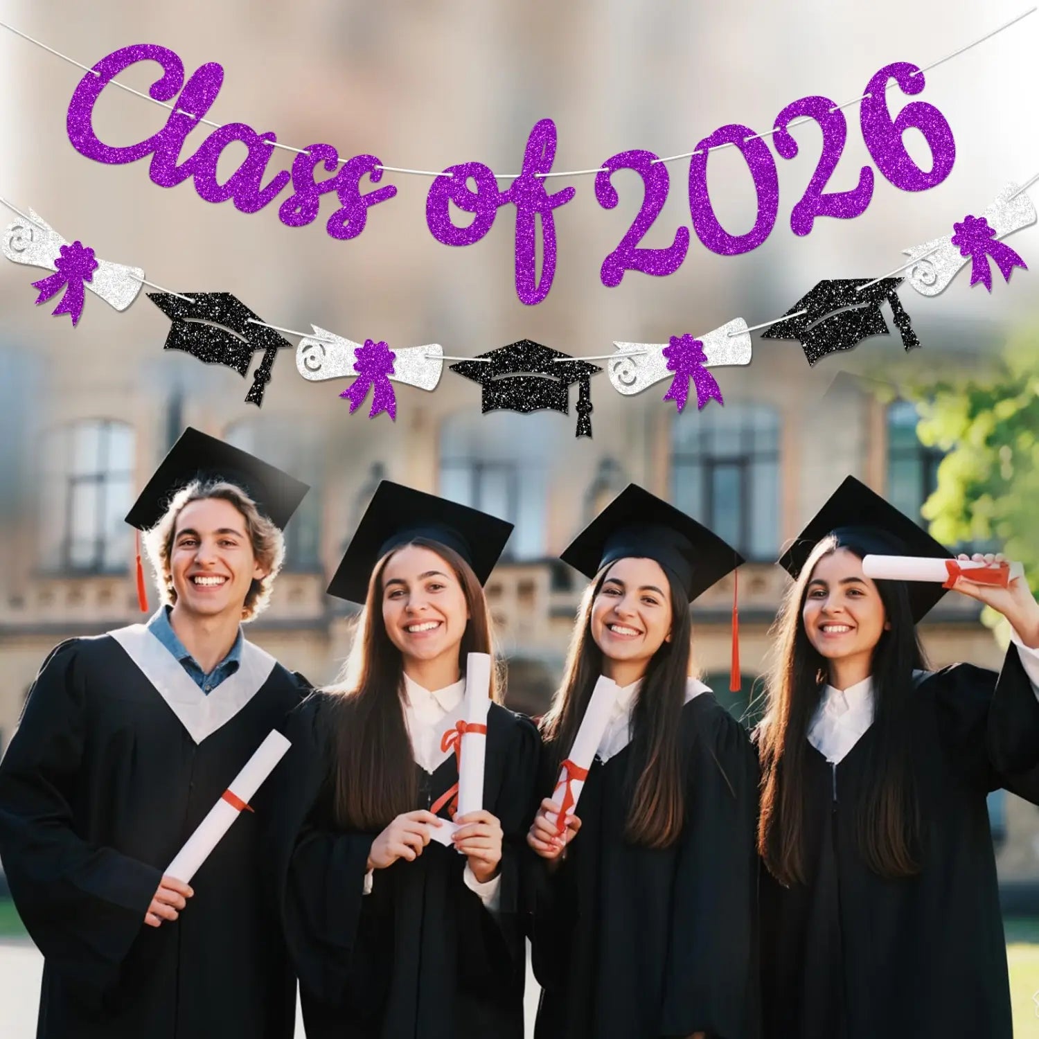Purple glitter class of 2026 graduation banner and garland featuring black and silver graduation cap cutouts for celebratory decoration.