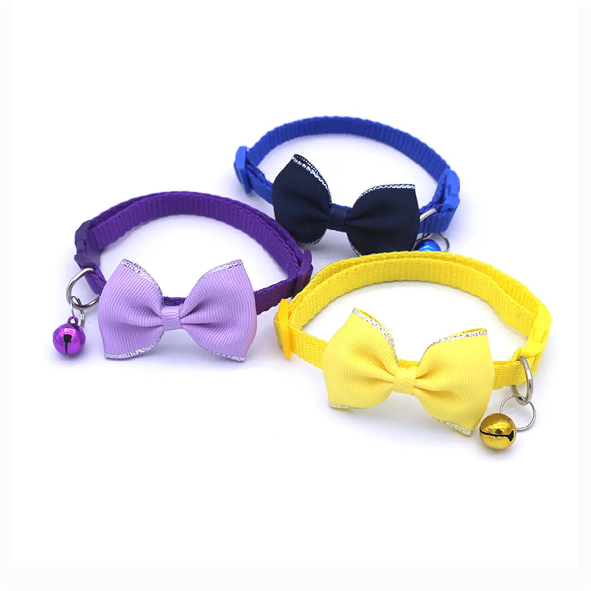 Three colorful cat collars with matching ribbon bows featuring silver trim and adjustable small bells in a multicolor bowtie set.