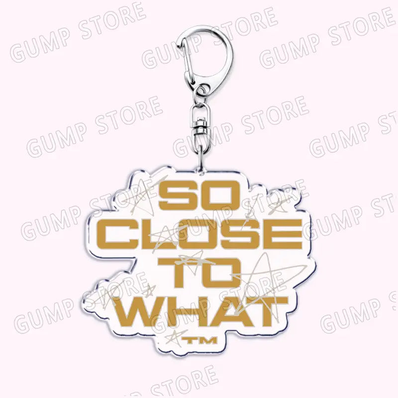 Tate Mcrae acrylic keychain with a gold-accented white cloud-shaped outline and silver metal clasp designed as a music fan gift.