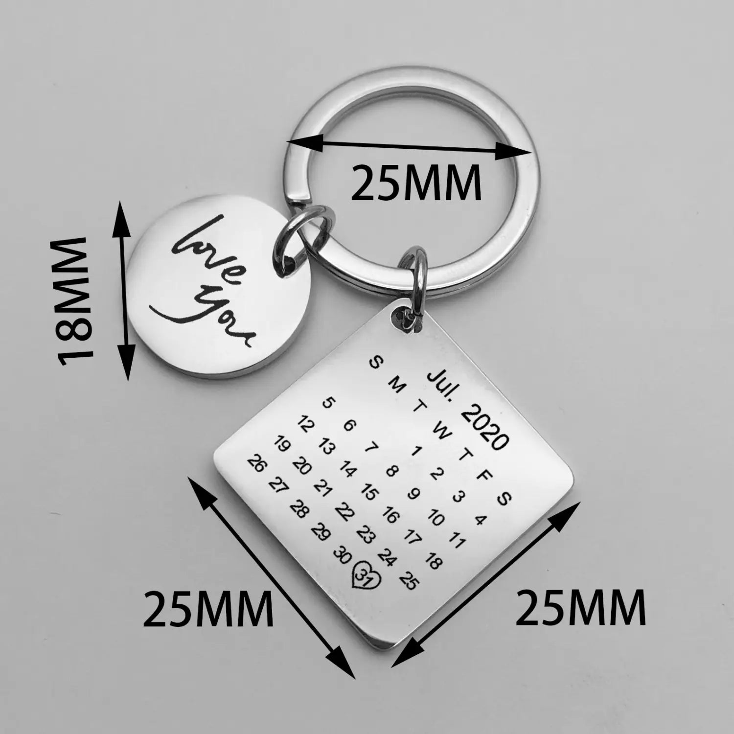 Silver personalized calendar keychain featuring a square July 2020 calendar charm and a round love you disc both engraved with black lettering ideal for custom anniversary gifts.