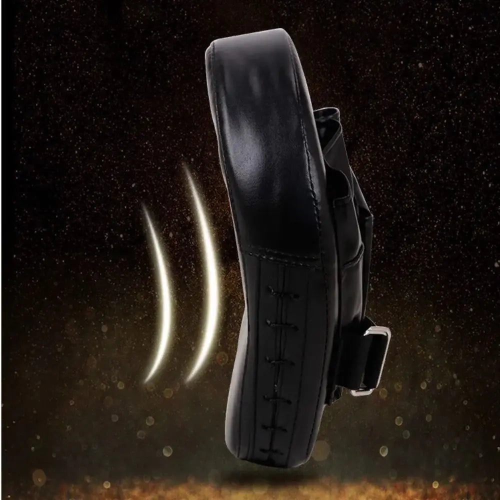 Black leather boxing punch pad focus mitt target fitness gear with stitched detailing and metal buckle.