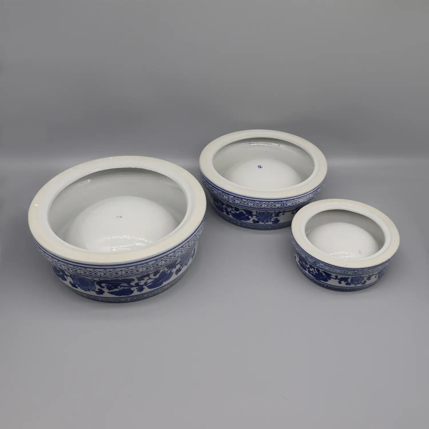 three blue and white feeding bowl ceramic set with intricate floral porcelain patterns