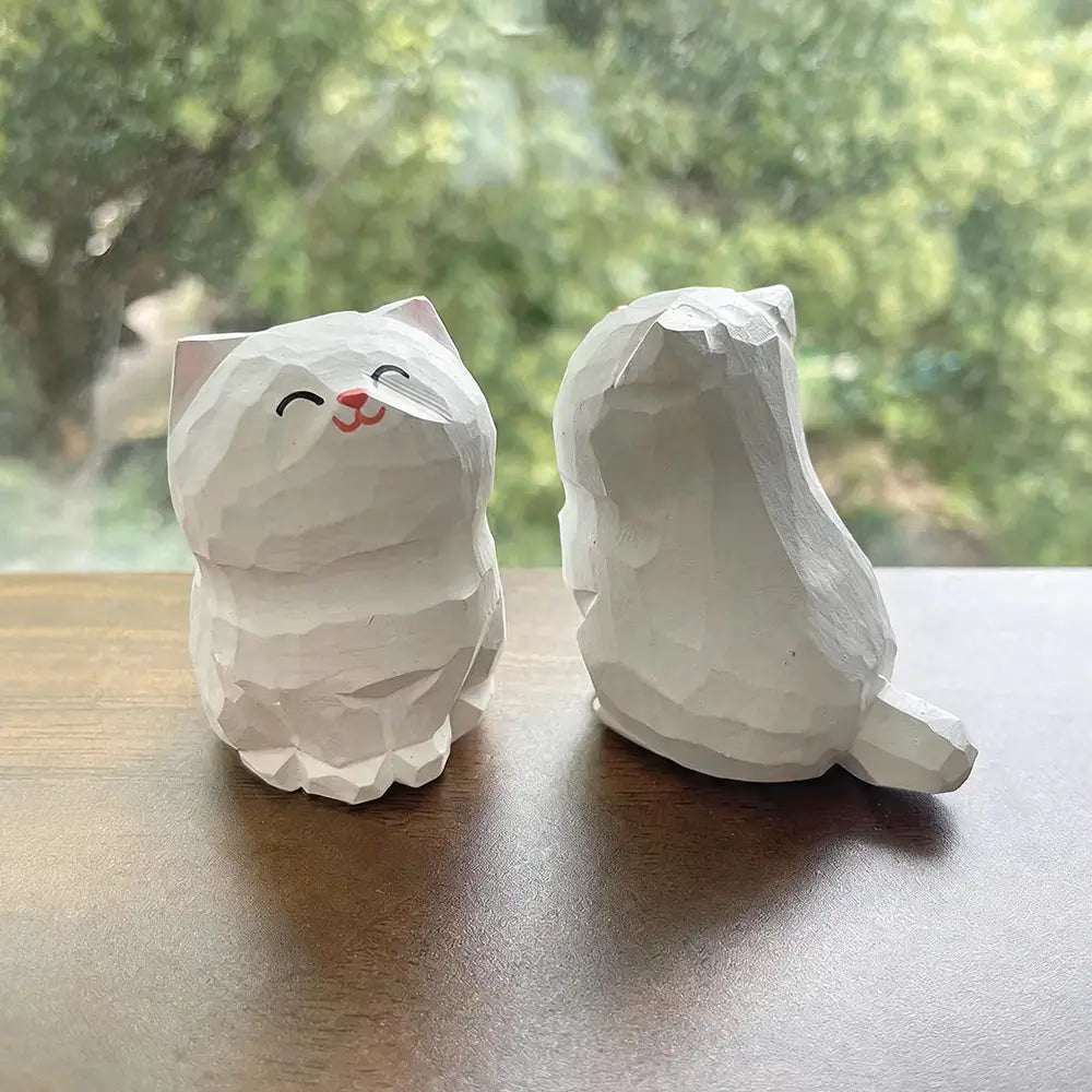 Handcrafted wooden cat figurine desk decor featuring white geometrically carved wood with one actual product showing a smiling face and red nose factory direct.
