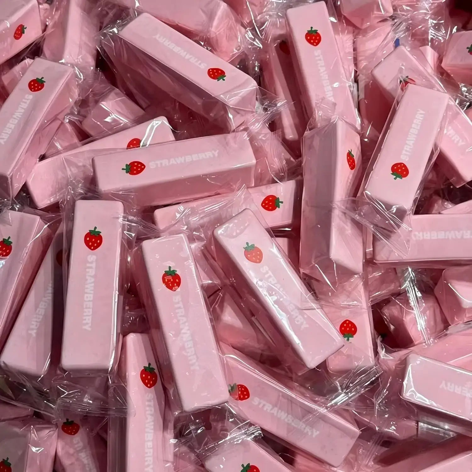 pink strawberry-themed slow rising squishy butter stress relief toy candy bars individually wrapped in clear plastic for butter squeeze use