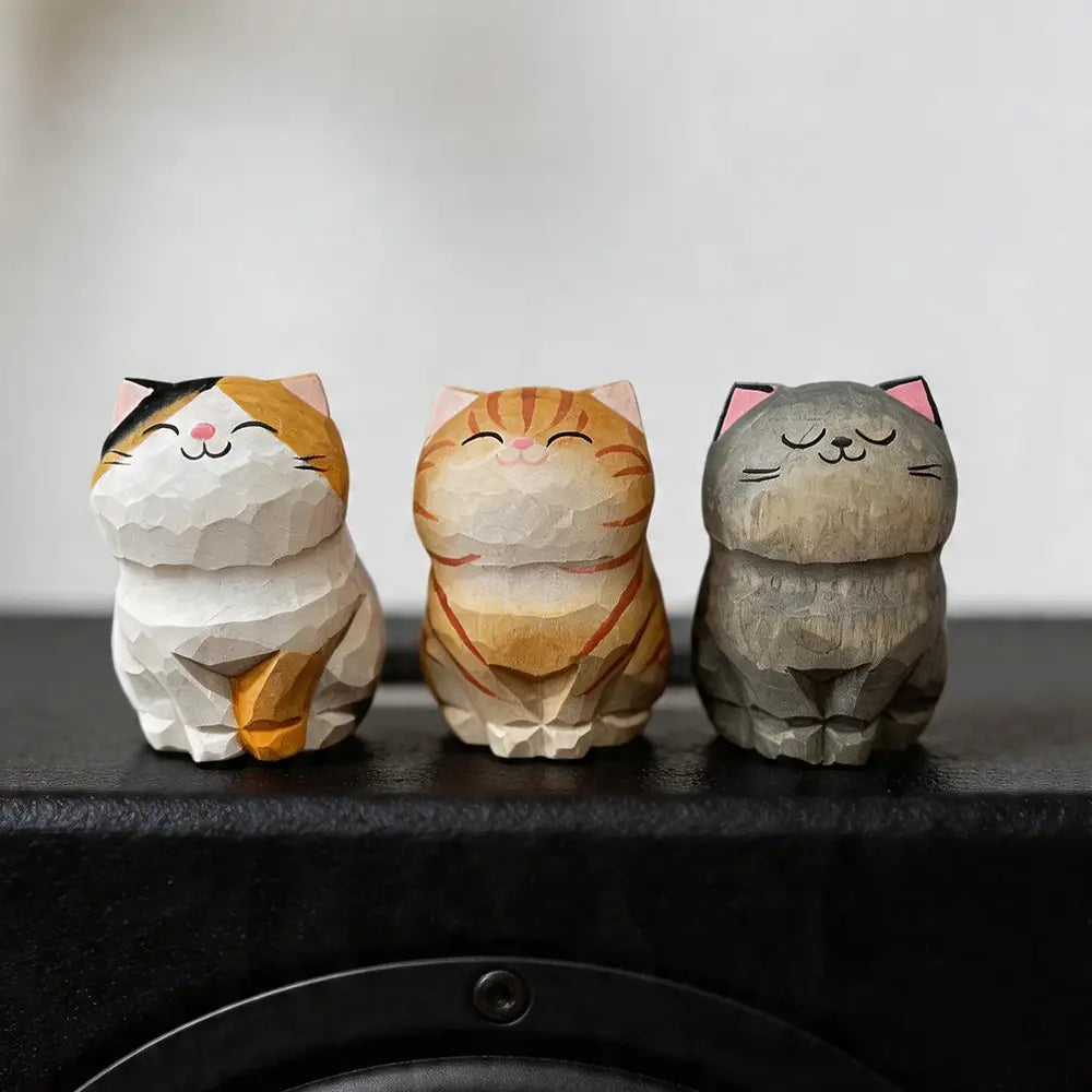 three charming geometrically carved wooden cat figurines with painted accents handcrafted as actual product desk decor available factory direct